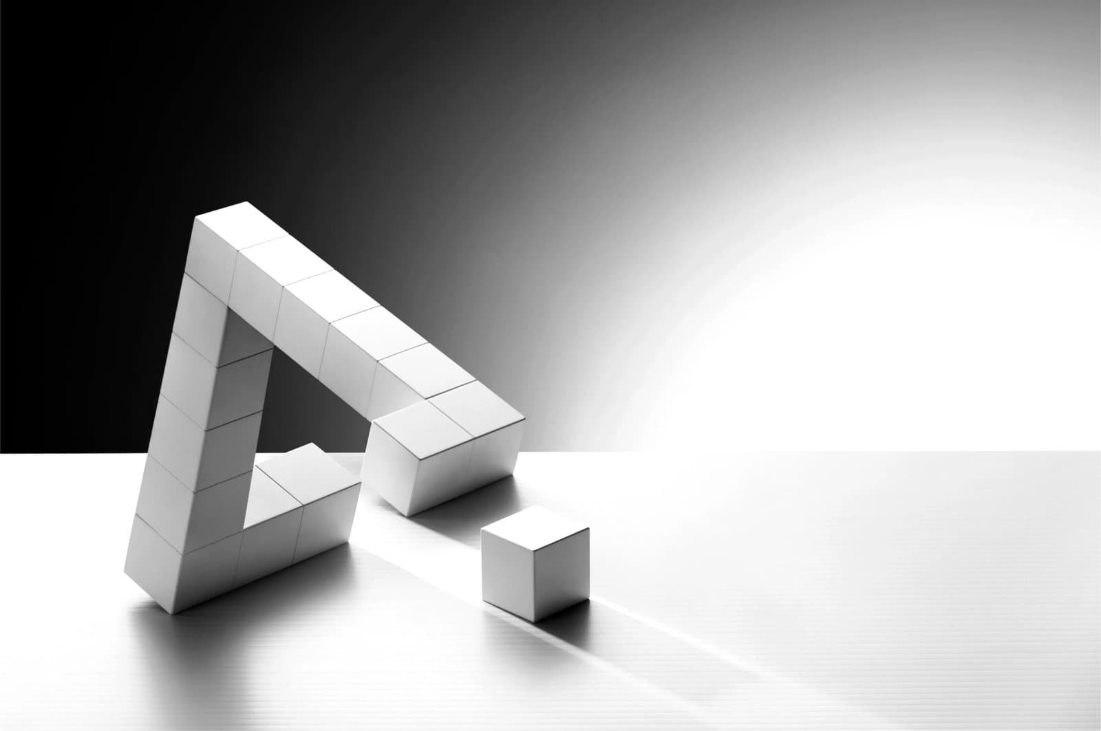Penrose triangle illusion constructed from white blocks