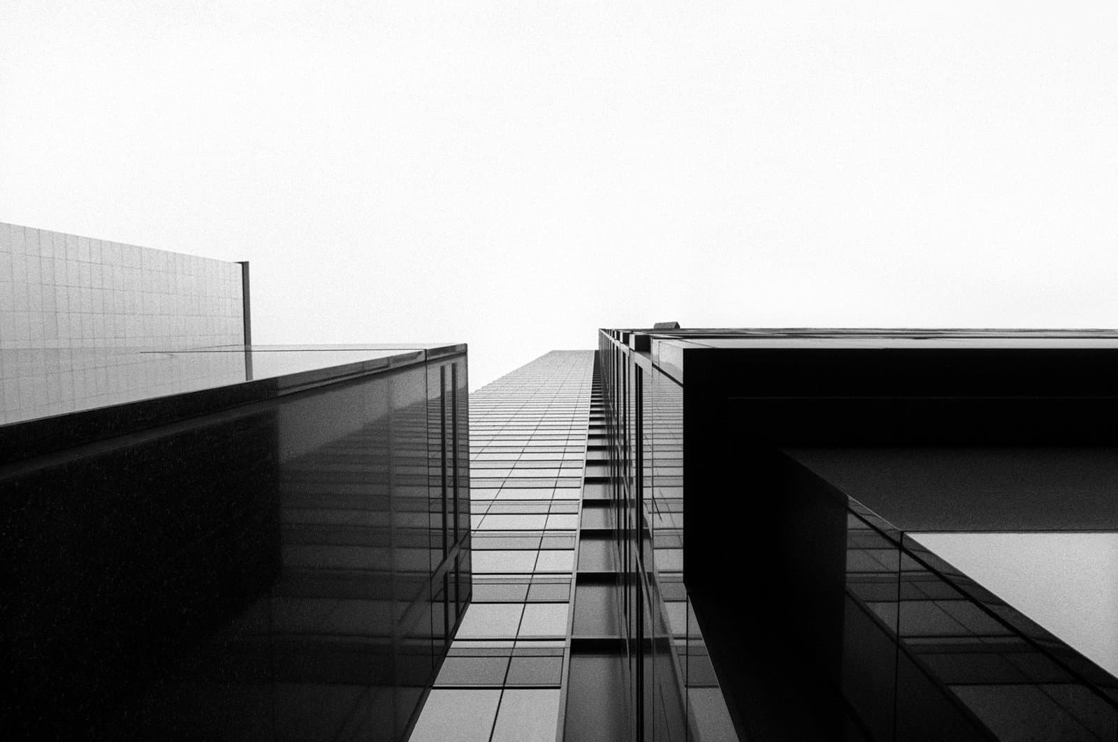 Looking up at a skyscraper from a close perspective 