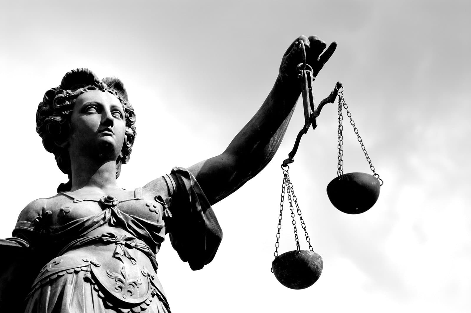 Statue of a woman holding a balance scale