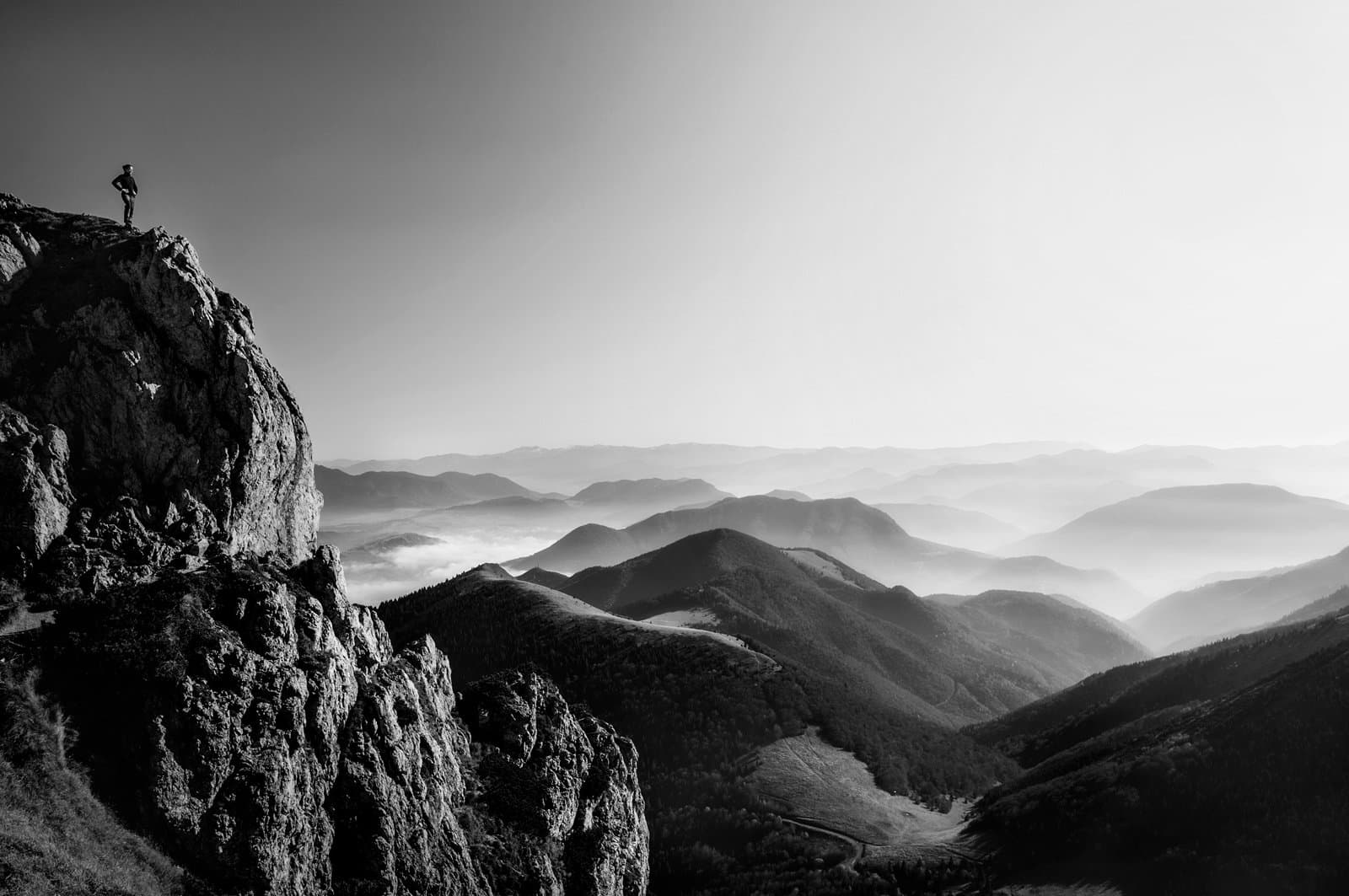 Woman standing on top of rock